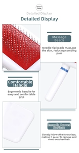 Detail of pet grooming brush showing massage beads, ergonomic handle and curved design