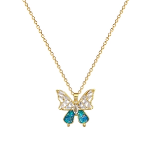Elegant gold titanium necklace with blue butterfly pendant featuring crystal pavé details