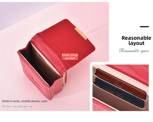 Internal view of red leather wallet showing four card slots and phone compartment