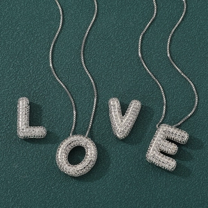 Balloon style LOVE letters necklace in silver plating with sparkling zircon stones
