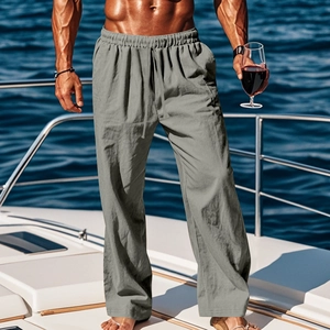 Men's grey linen wide-leg pants with drawstring waist shown on a luxury yacht
