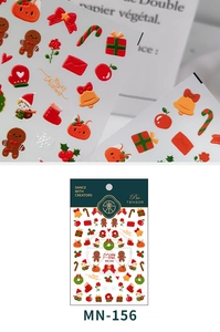 Detailed macro view of 3D embossed Christmas nail stickers with gingerbread man design