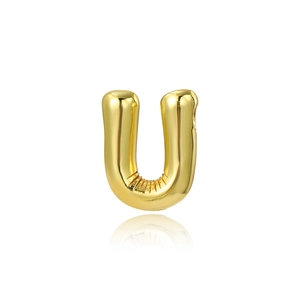 Detailed view of polished 18K gold letter U pendant with 3D puff balloon style texture