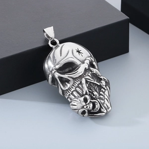 Detail of silver Viking skull pendant with punk rock design and metallic texture