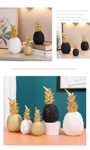 Detail of modern resin pineapple ornament with textured geometric patterns in gold and white