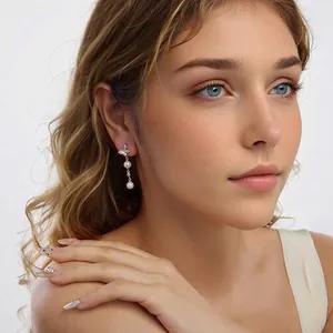 Elegant S925 silver butterfly drop earrings with white pearls for a graceful jewelry look