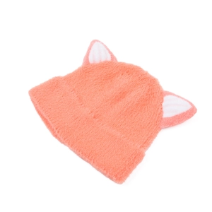 Detail of coral pink knitted beanie featuring fuzzy cat ears and soft plush texture