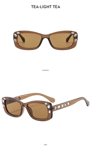 Macro view of square vintage tea sunglasses with rhinestone accents and crystal temples