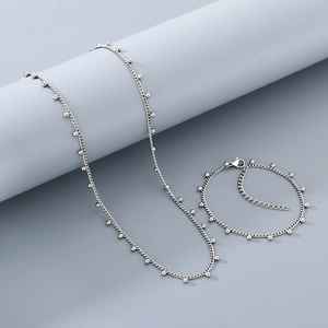 Détails d'un ensemble de collier et bracelet en acier inoxydable argenté avec fermoir homard