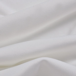 Detailed macro view of white fabric texture showing soft draping and fine knitting quality