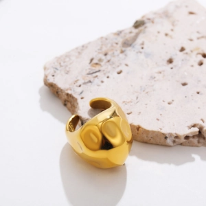 Detailed close-up of 18K gold stainless steel ring with a hammered vintage texture