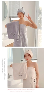 Detailed view of grey and beige coral fleece hair drying cap and bath towel set