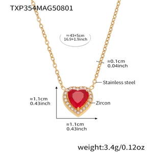 Detailed view of gold stainless steel heart necklace with red zircon and crystal accents