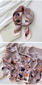 Detail of a square silk scarf with watercolor floral patterns in purple and pink