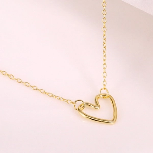 Minimalist S925 sterling silver hollow heart pendant necklace in elegant gold finish