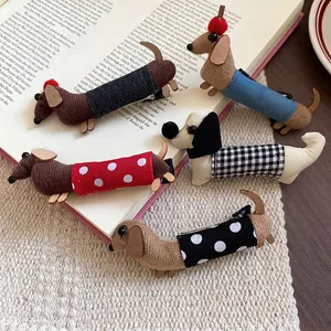 Polka dot dachshund fabric hair clips in five colors on a textured aesthetic background