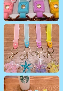 Close-up of ocean-themed acrylic keychains with floating glitter and starfish charms