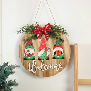 Christmas wooden welcome sign featuring three festive gnomes and a red plaid bow