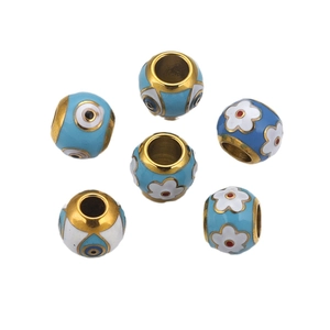 Polished gold-plated stainless steel beads with blue enamel evil eye and floral motifs