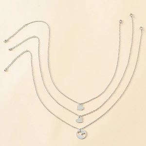 Three-piece stainless steel necklace set with heart pendants and adjustable lobster clasp