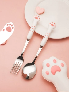 Macro shot of 304 stainless steel cutlery set with cute pink cat paw ceramic handles