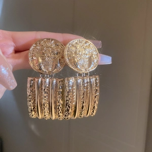 Vintage gold portrait earrings with Medusa relief and rectangular textured drop pendants