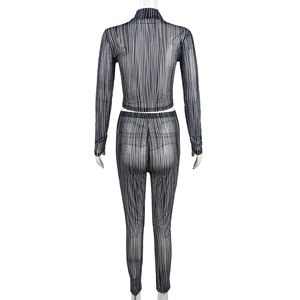 Detail view of black and white striped mesh crop top and leggings set from back on mannequin