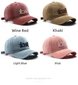 Detailed grid view of washed cotton baseball caps in wine red, khaki, blue, and pink colors