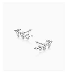 Close-up of S925 sterling silver olive leaf earrings with shimmering white zirconia