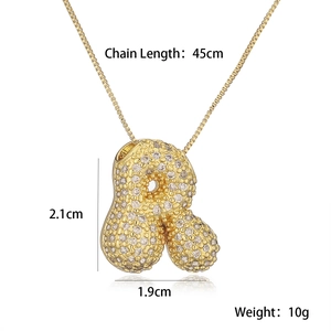 Detailed view of gold plated letter R pendant with cubic zirconia and chain measurements