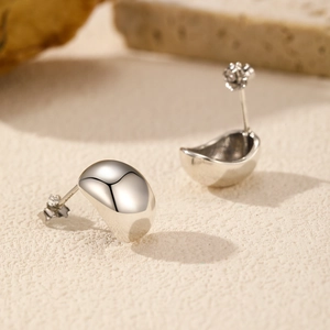 Polished S925 sterling silver bean-shaped stud earrings with reflective mirror finish