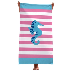 Pink and white striped microfiber beach towel featuring a central blue seahorse design
