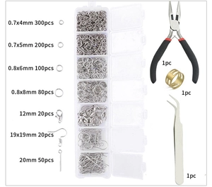 Detail view of 7-grid jewelry DIY kit with lobster clasps, jump rings and pliers