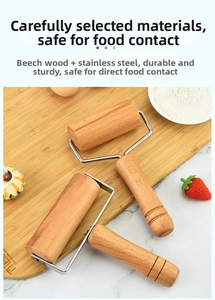 Detail of beech wood rolling pin with stainless steel frame on a baking surface