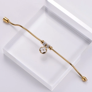 Golden snake chain bracelet with white shell clover charm and cubic zirconia beads