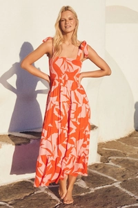 Close-up of shirred bodice and adjustable tie straps on floral maxi dress
