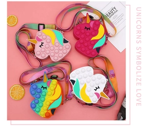 Detailed view of unicorn silicone bags in pink and rainbow colors with adjustable straps