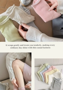 Detail showing colorful ribbed knit cotton socks in soft macaron pastel tones