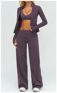 Three-piece yoga set in plum purple featuring zip-up jacket, sports bra and flared pants