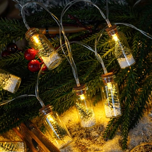 LED Christmas wishing bottle string lights with miniature trees and snow inside glass jars