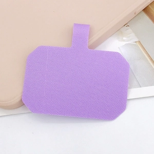 Close-up of purple phone lanyard tether tab with reinforced woven texture and metal ring