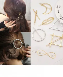 Detailed close-up of geometric gold and silver alloy hair clips in various chic shapes