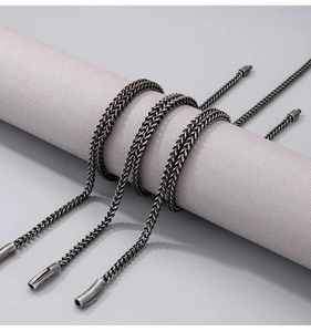 Detailed view of dark grey woven stainless steel keel chain with vintage matte finish