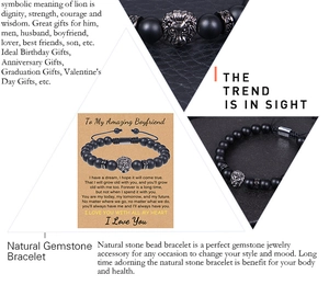 Macro detail of lion head charm on matte black natural stone bracelet with gift card