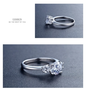 Macro shot of a luxury S925 silver three-stone ring with round-cut sparkling zircons