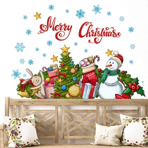 Christmas wall stickers with snowman, bunny and tree on a white wall above a wooden bench
