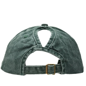 Detail of washed cotton baseball cap with ponytail hole and adjustable metal buckle