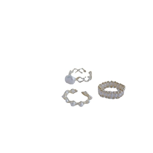 Three-piece gold plated ring set featuring natural freshwater pearls in geometric designs