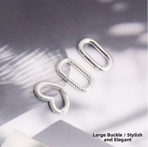Detailed view of S925 sterling silver spring clasps in oval and heart shapes for jewelry