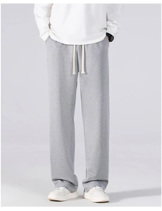Detail of grey casual jogger pants featuring straight-leg cut and drawstring waistband